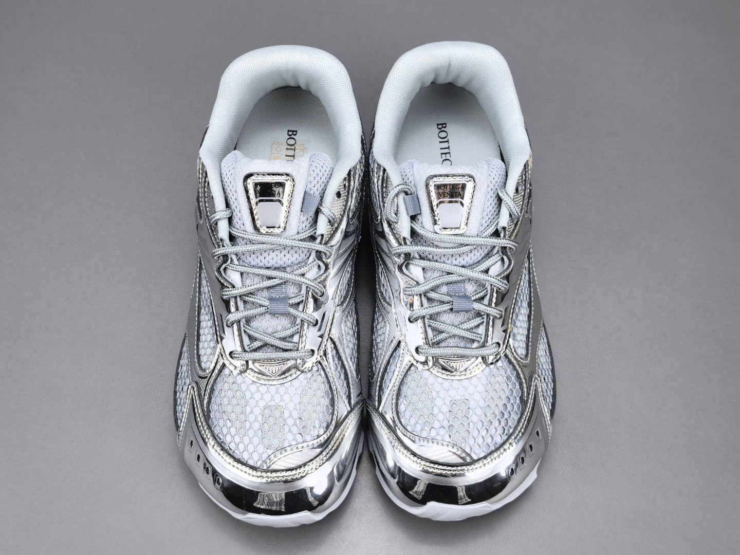 BOTTEGA VENETA Orbit metallic-panel net-covered low-top trainers Sliver