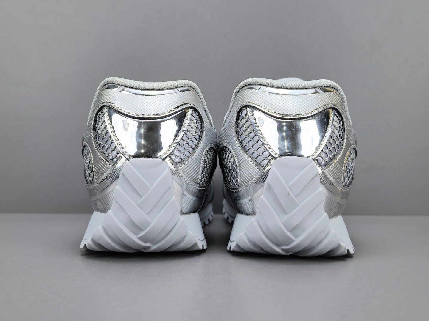 BOTTEGA VENETA Orbit metallic-panel net-covered low-top trainers Sliver