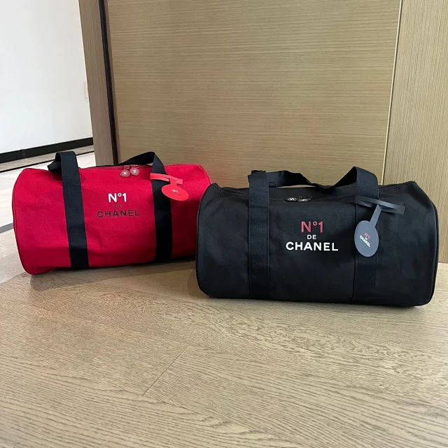 Chanel black and Red neutral Camellia travel bag and gym bag