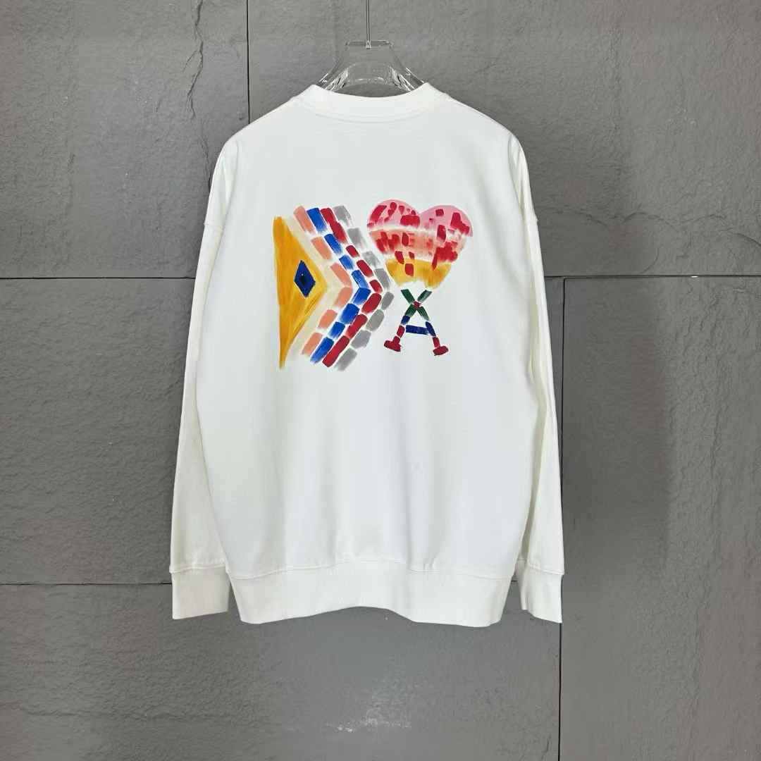 AMI Paris Ami de Coeur Sweatshirt in white with a red heart logo.