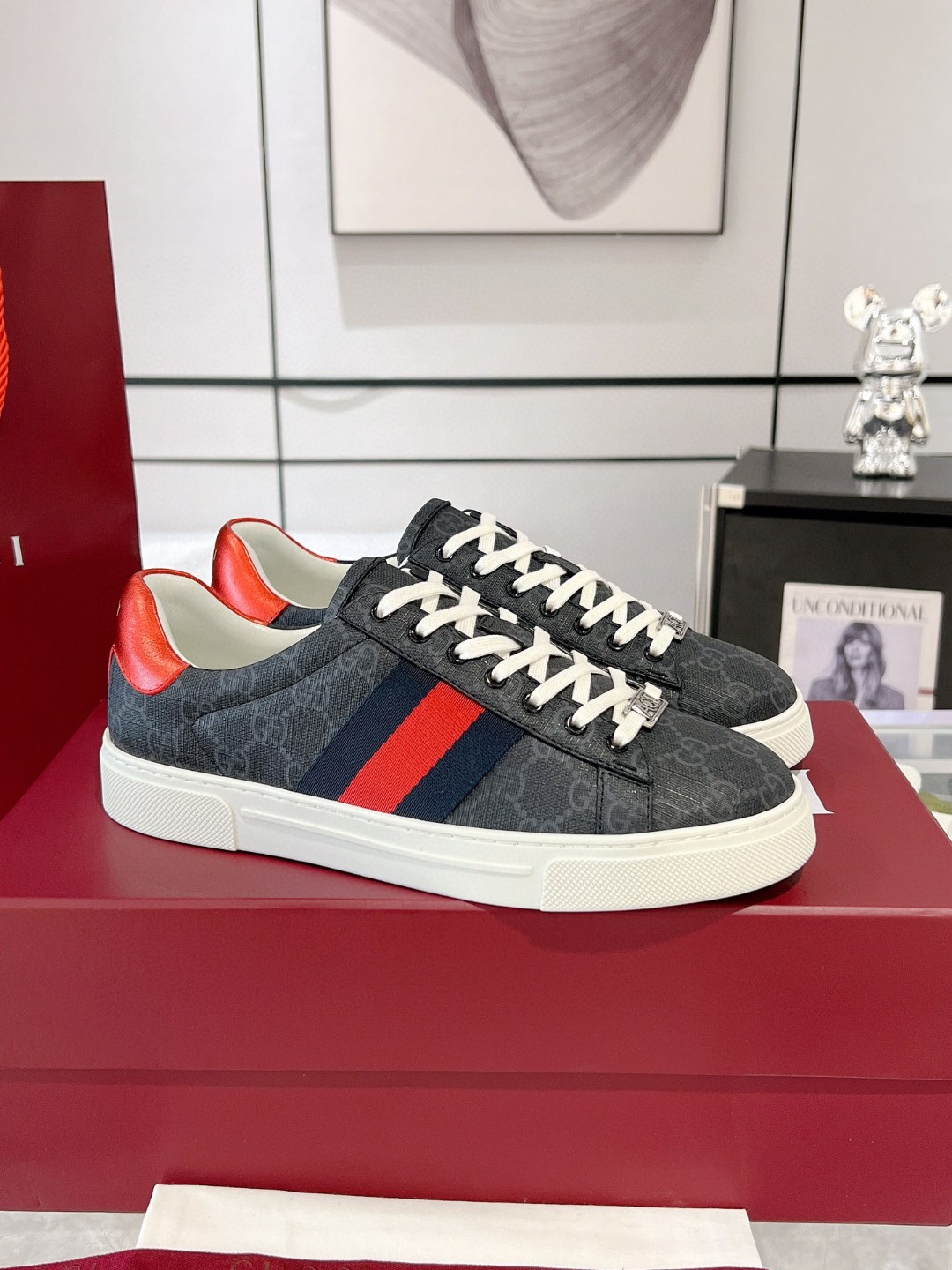 Gucci Ace GG Supreme sneakers with the iconic red and blue Web stripe