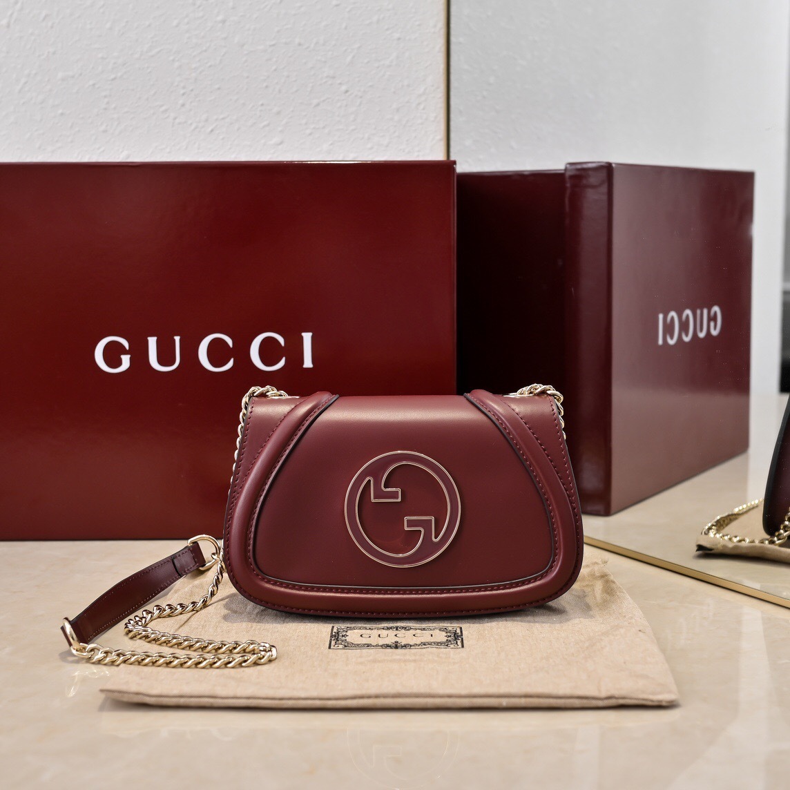 Gucci Blondie Mini Shoulder Bag in burgundy leather with a gold chain strap
