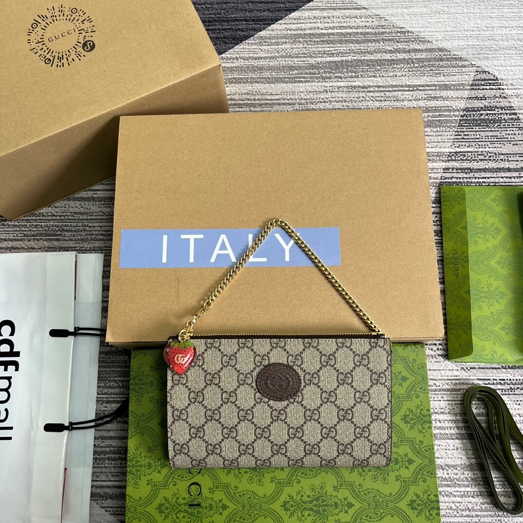 Gucci GG Supreme Strawberry Clutch Bag with a charm