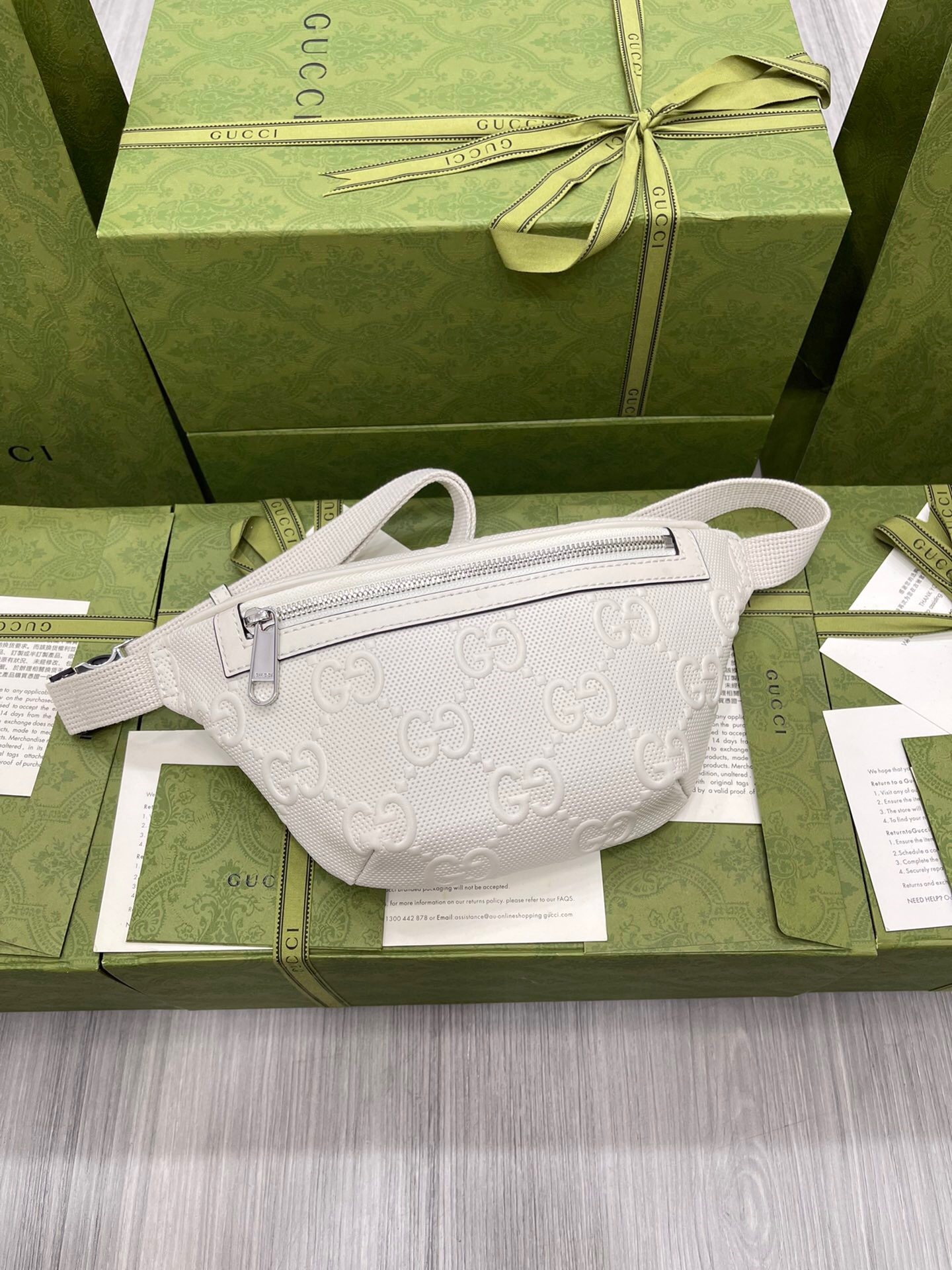 Gucci GG Embossed Belt Bag in white leather