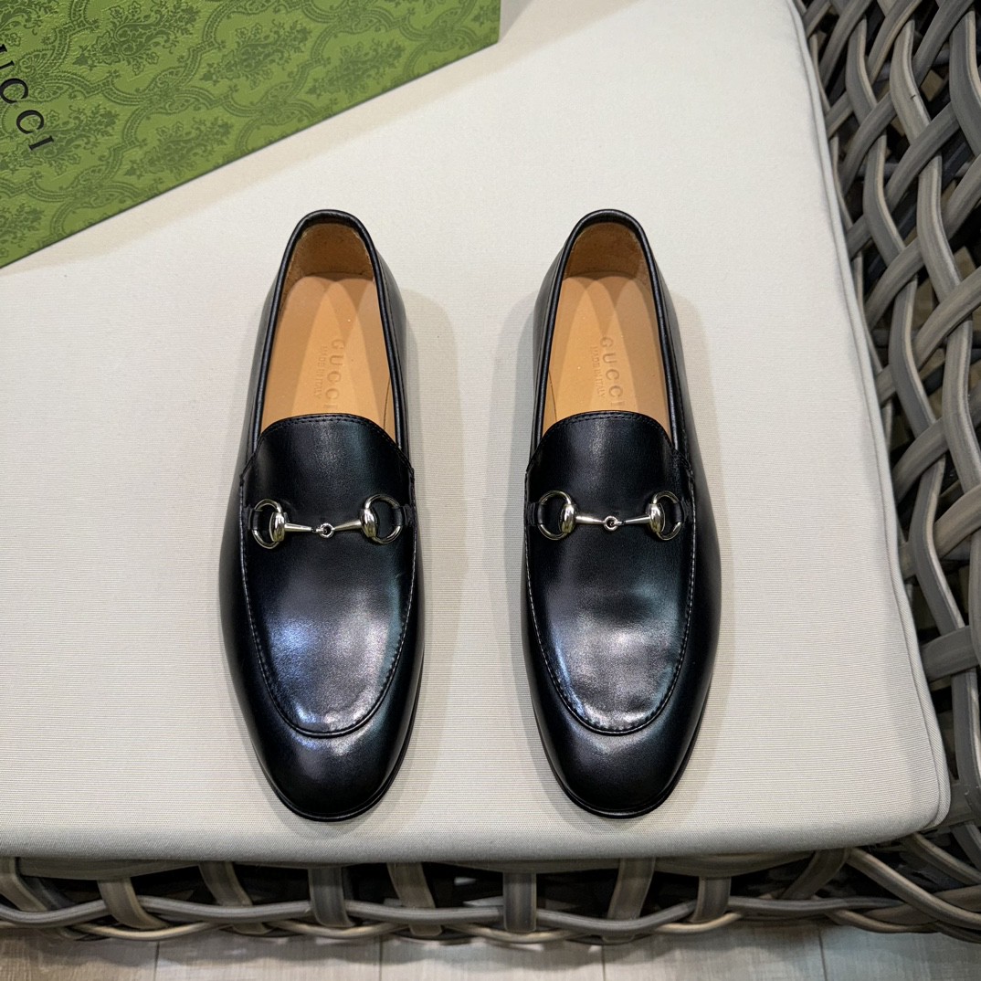 Gucci Men's Jordaan Horsebit Loafers in black leather.