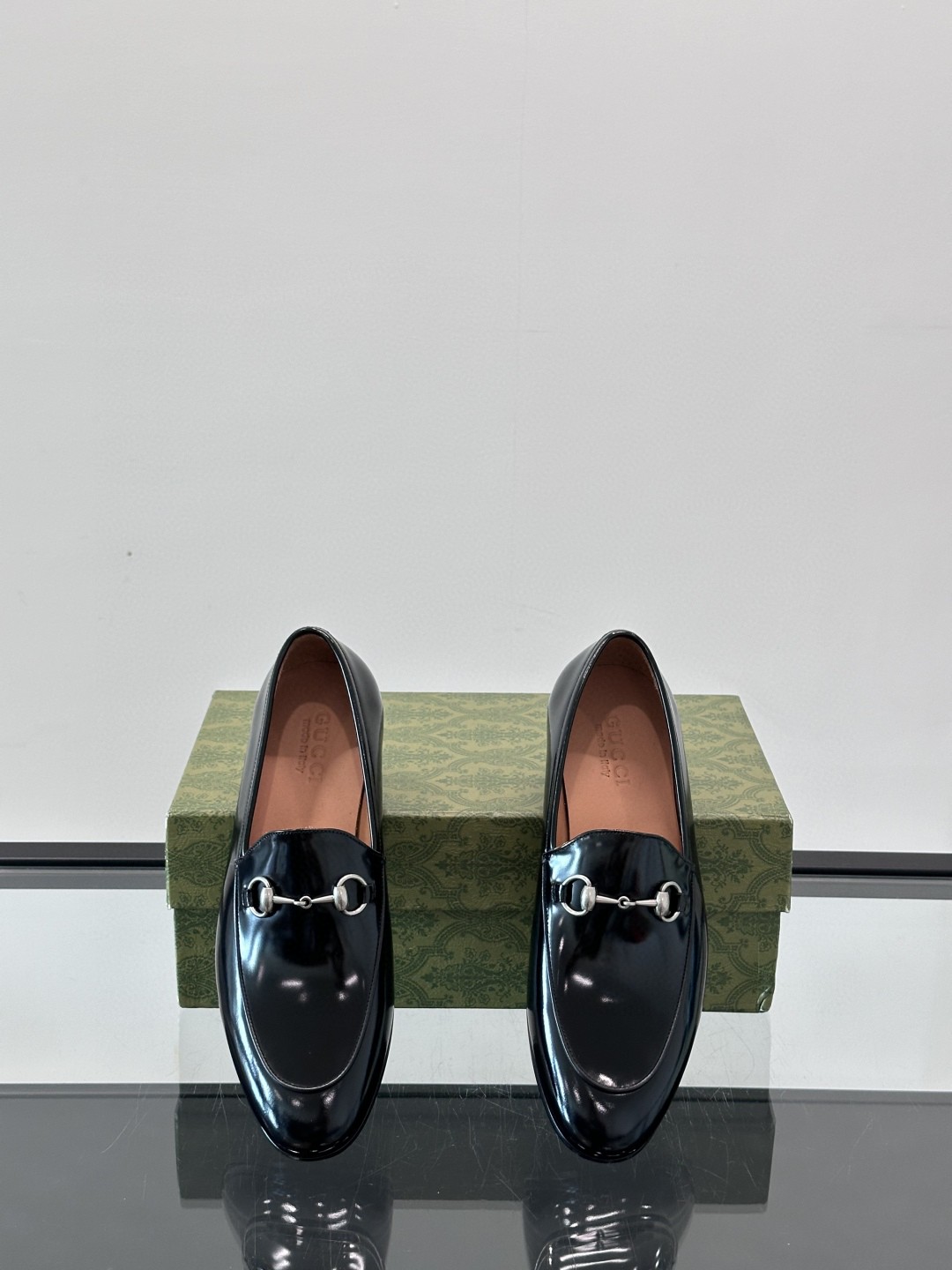 Gucci Men's Jordaan Horsebit Loafers in black leather.