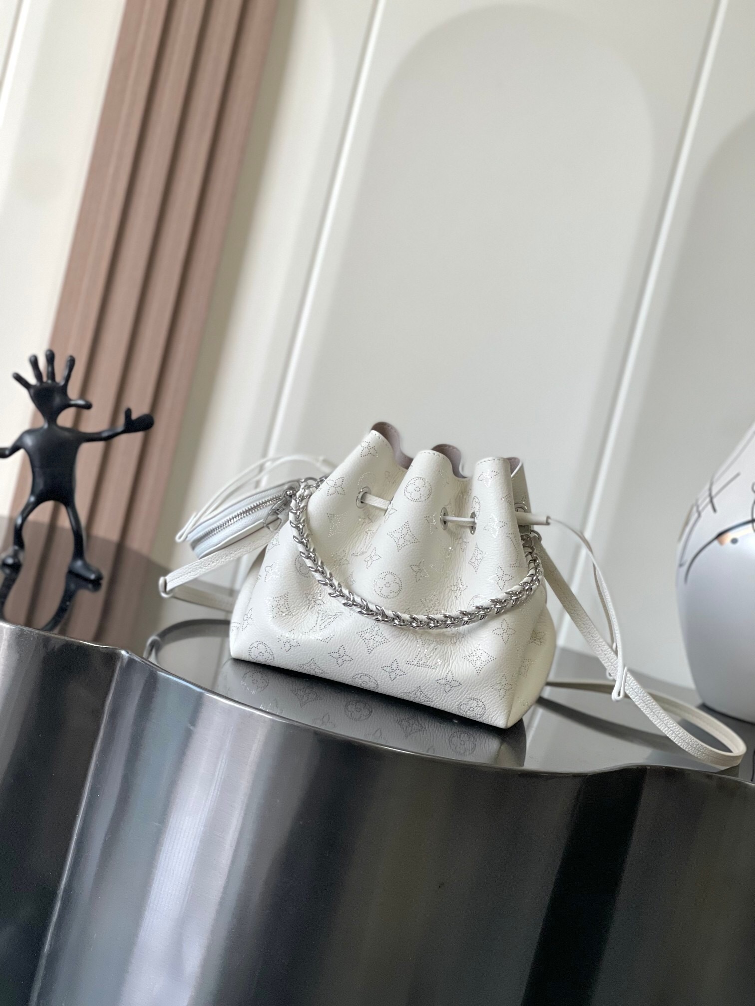 LV Bella bucket bag in Mahina perforated calf leather.