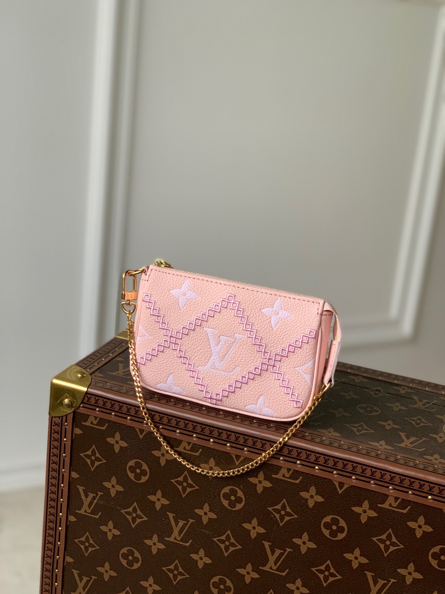 LV Mini Pochette Accessoires bag in pink Monogram Empreinte leather