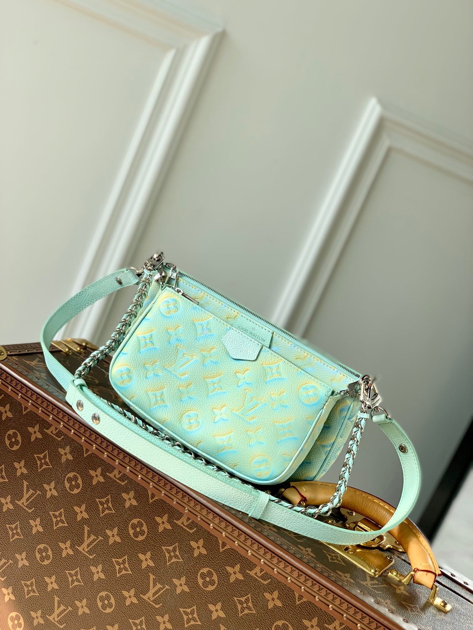 LV Multi Pochette Accessoires bag in a light blue and yellow colorway