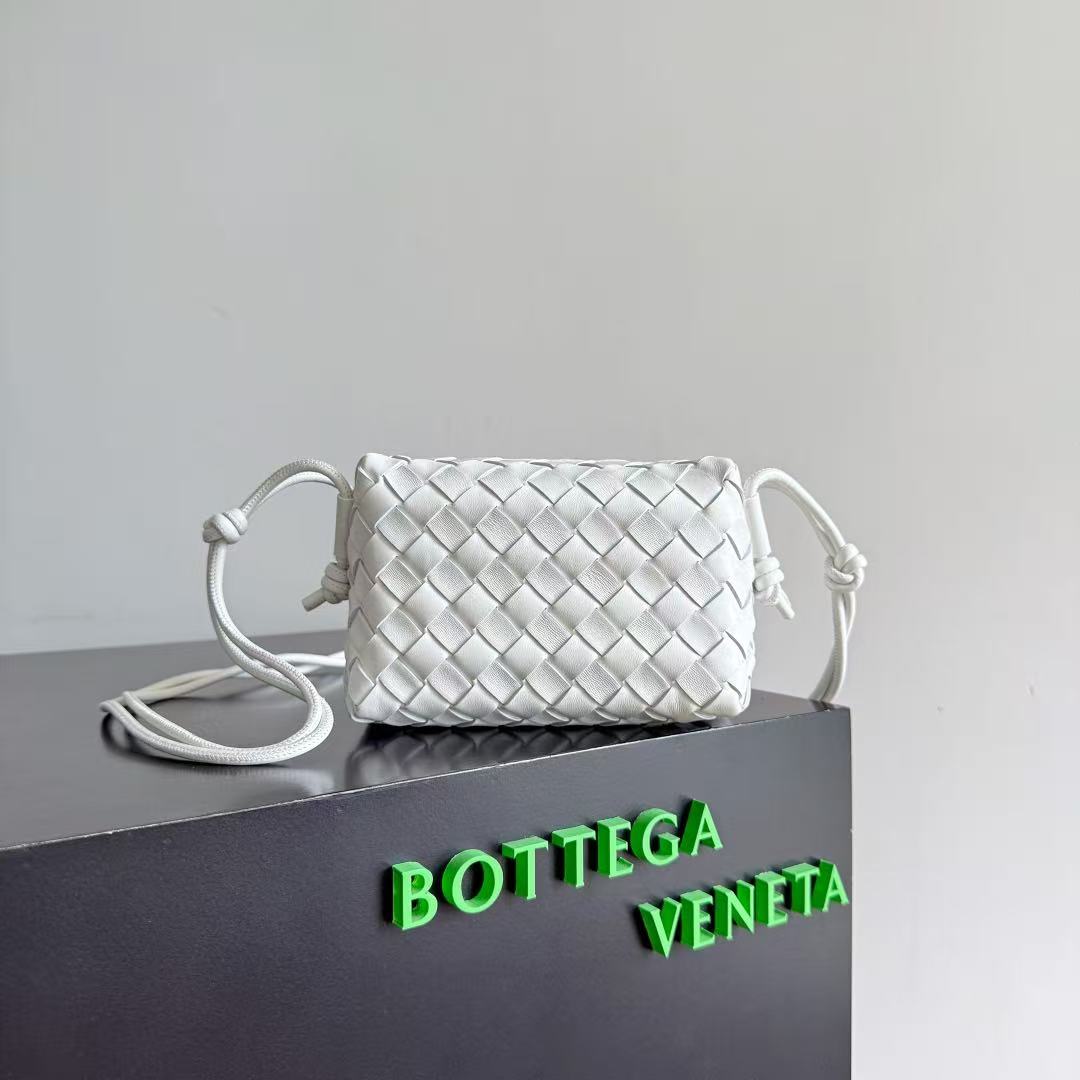 Bottega Veneta Mini Loop bag in bone or white intrecciato leather with muse brass hardware.