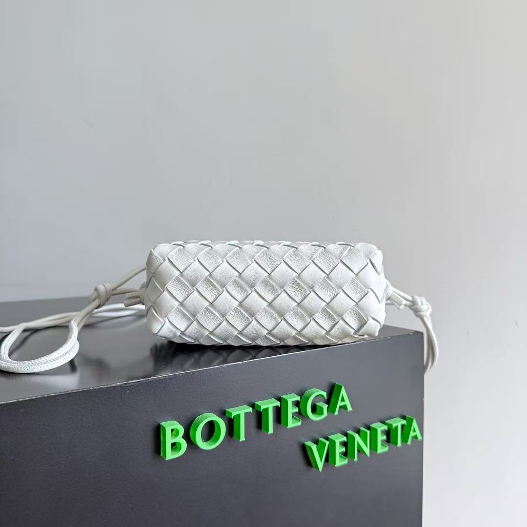 Bottega Veneta Mini Loop bag in bone or white intrecciato leather with muse brass hardware.