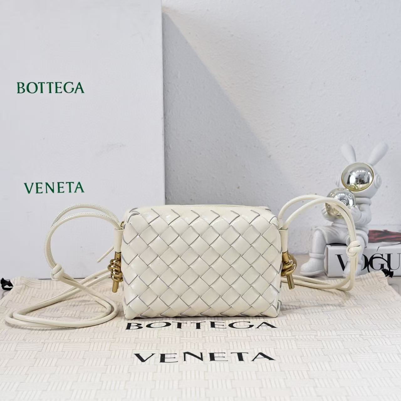 Bottega Veneta Mini Loop bag in bone or white intrecciato leather with muse brass hardware