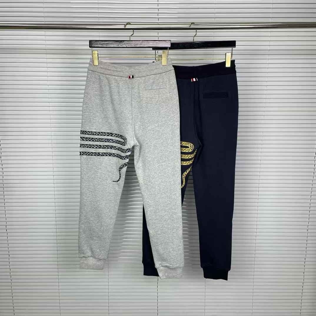 Thom Browne snake-embroidery cotton track pants in grey and navy blue