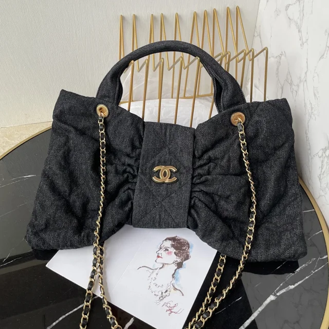 Chanel Maxi Bow Bag in black washed denim with gold-tone metal hardware