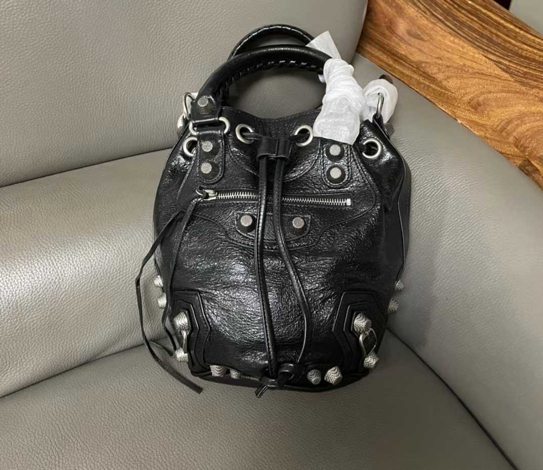 Balenciaga Le Cagole Small Bucket Bag in black.