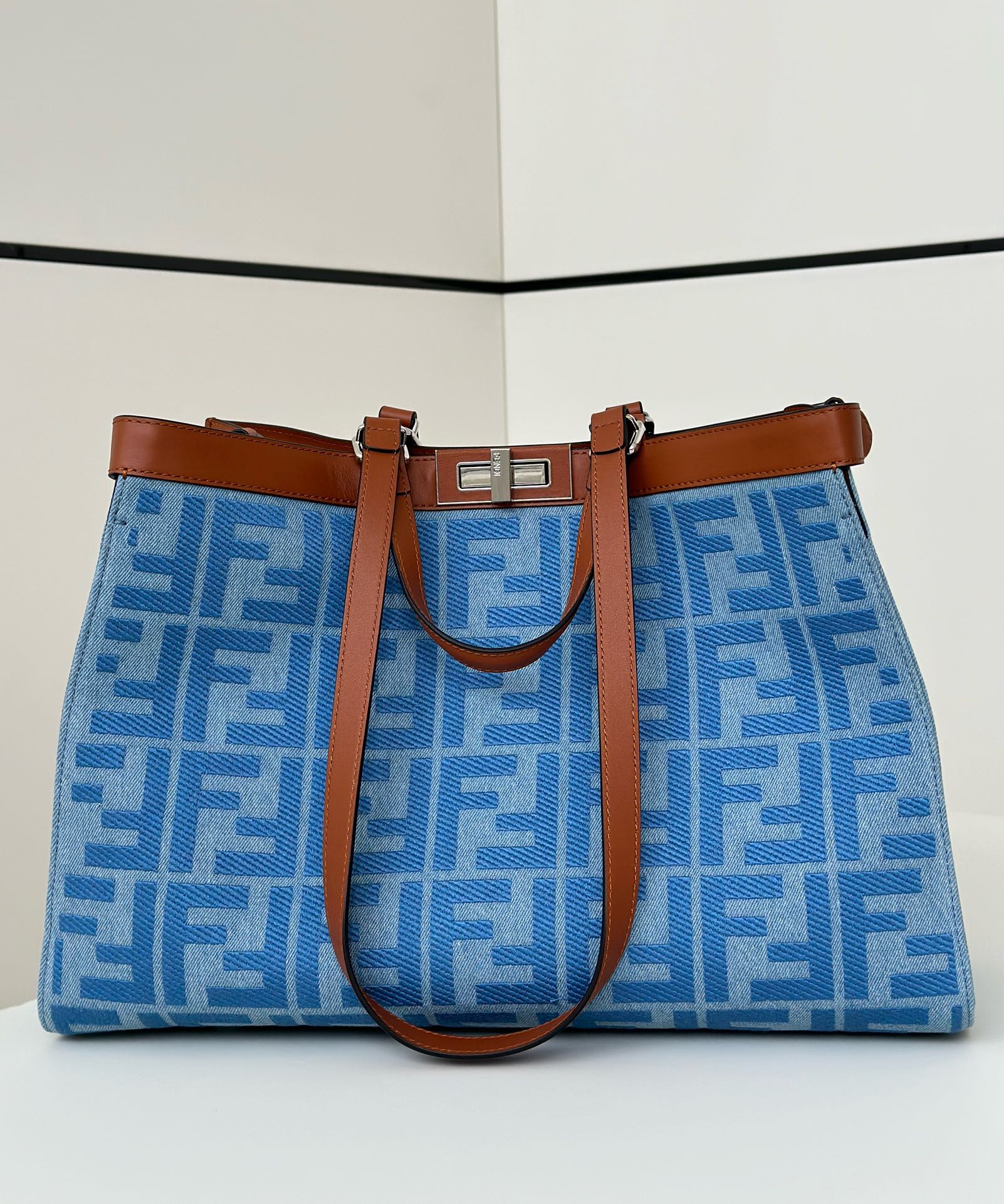 Fendi Peekaboo X-Tote bag with a blue FF logo print and brown leather trim