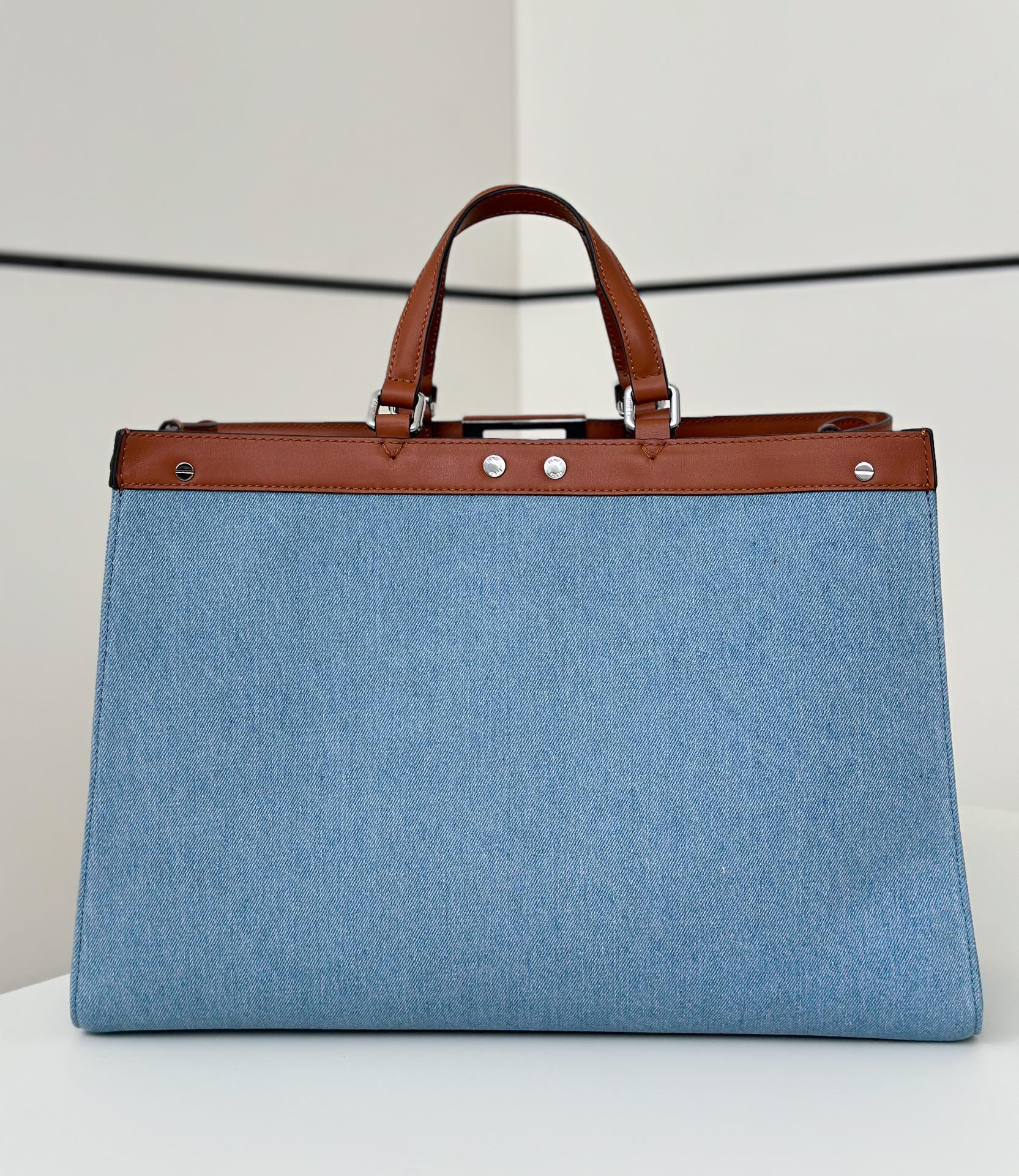 Fendi Peekaboo X-Tote bag with a blue FF logo print and brown leather trim