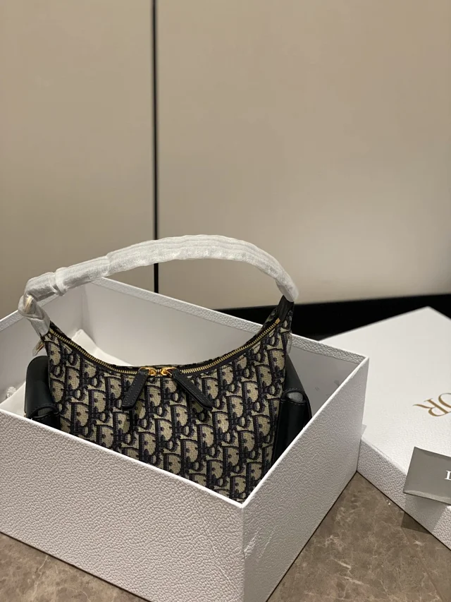 Dior D-Journey bag in blue Dior Oblique jacquard canvas.