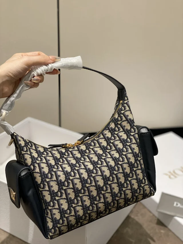 Dior D-Journey bag in blue Dior Oblique jacquard canvas.