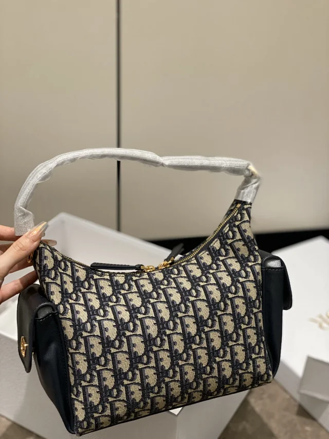 Dior D-Journey bag in blue Dior Oblique jacquard canvas.