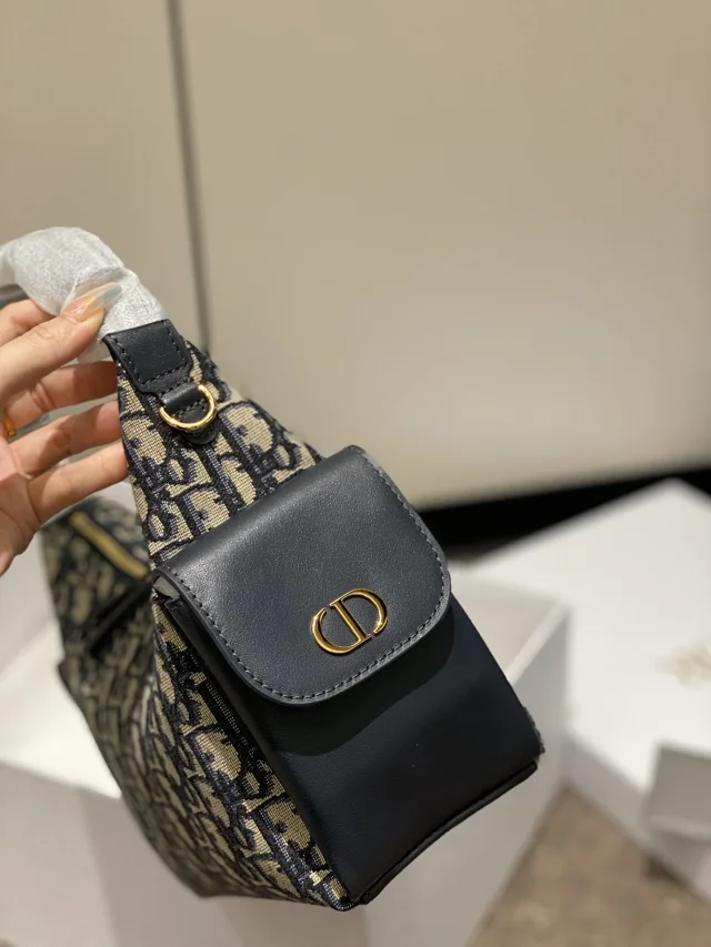 Dior D-Journey bag in blue Dior Oblique jacquard canvas.