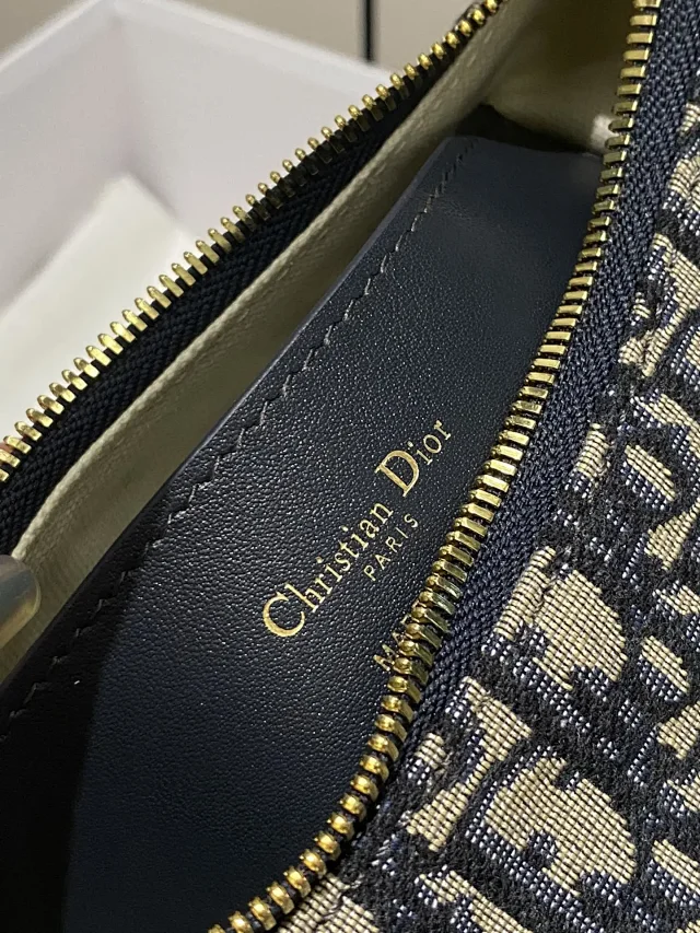 Dior D-Journey bag in blue Dior Oblique jacquard canvas.