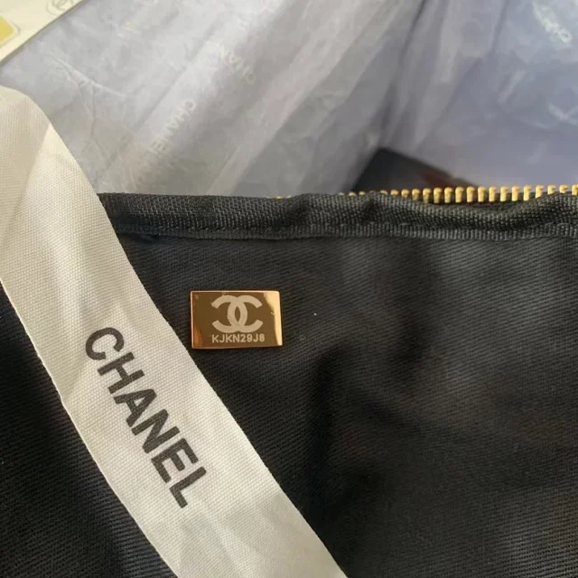 Chanel Nylon Grosgrain Large Lifestyle Travel bag in black.