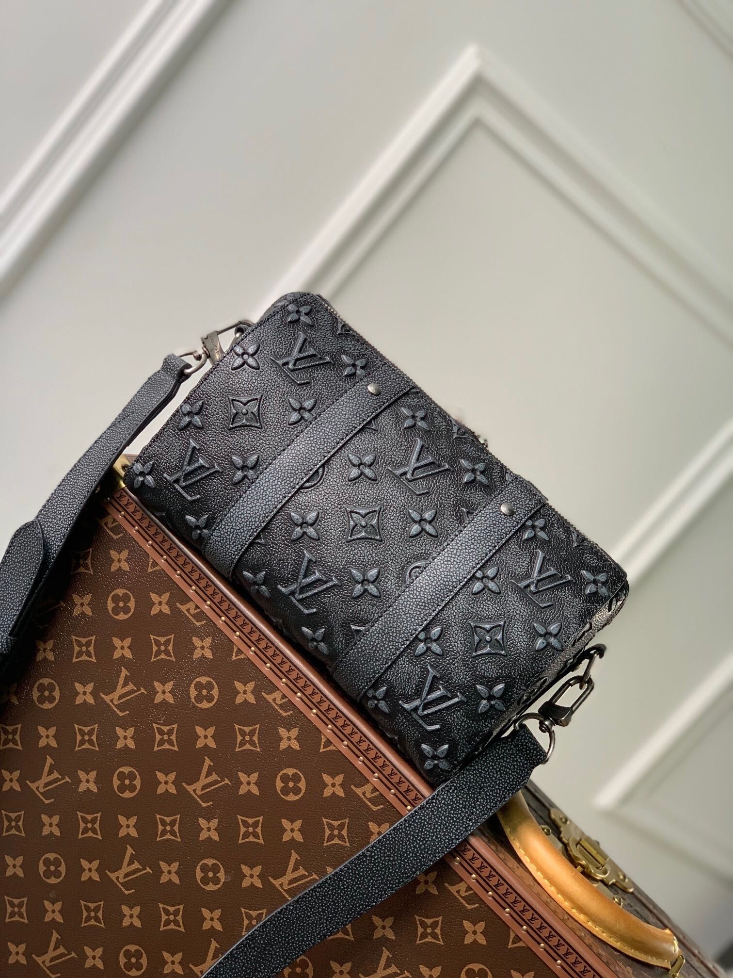 LV City Keepall bag in Monogram Shadow calf leather.
