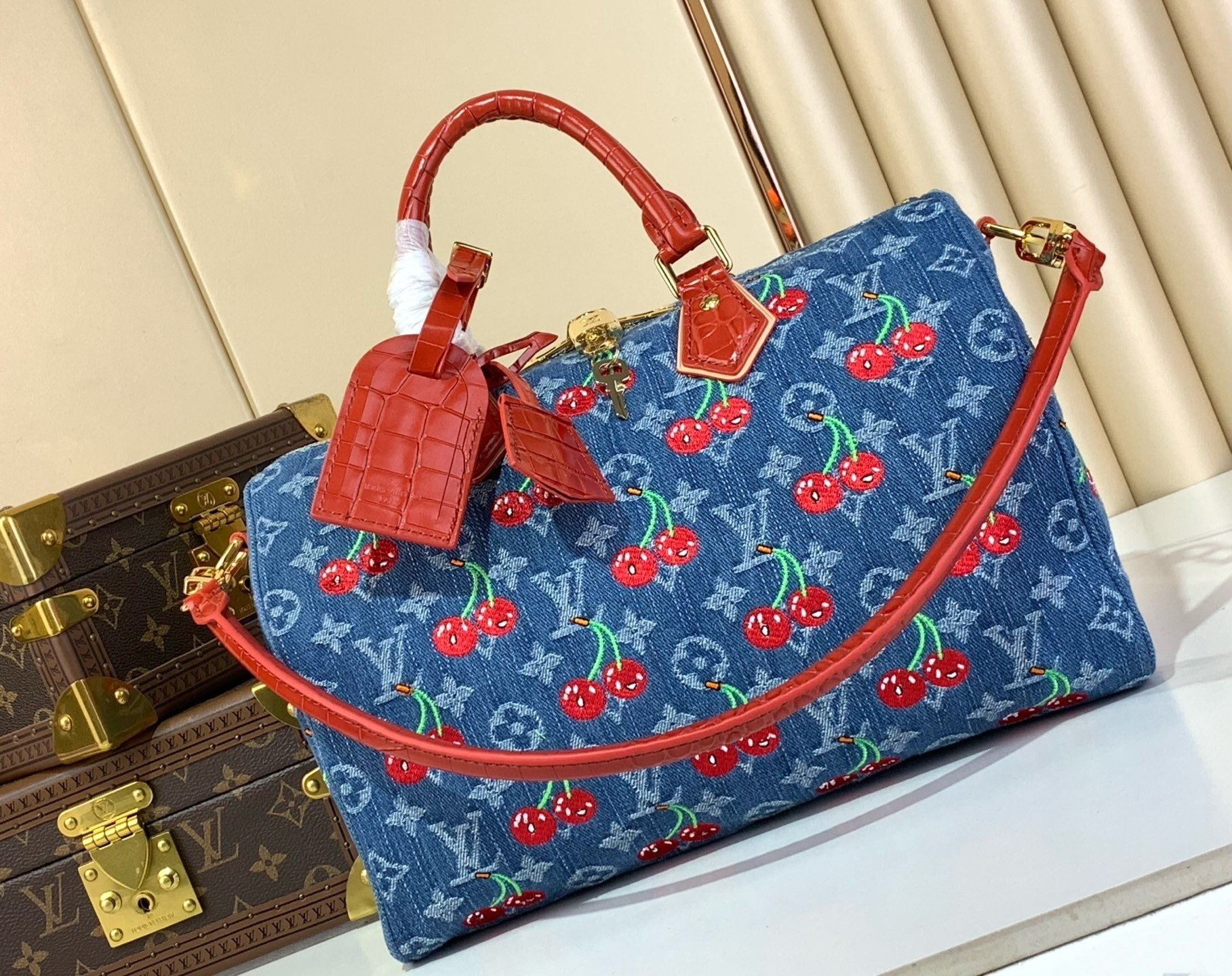 LV Speedy Soft 30 bag in Monogram Denim with a cherry motif from the Louis Vuitton x Murakami collection.
