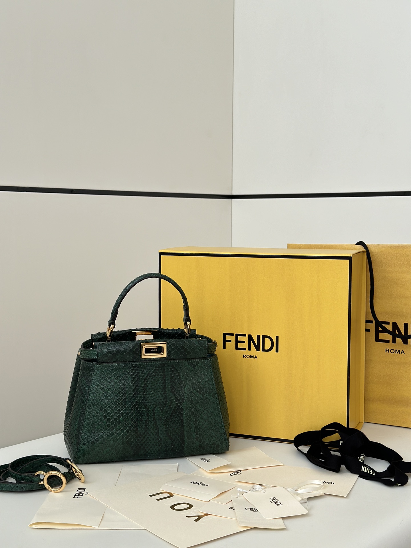 Fendi Peekaboo Mini bag in green snakeskin leather.
