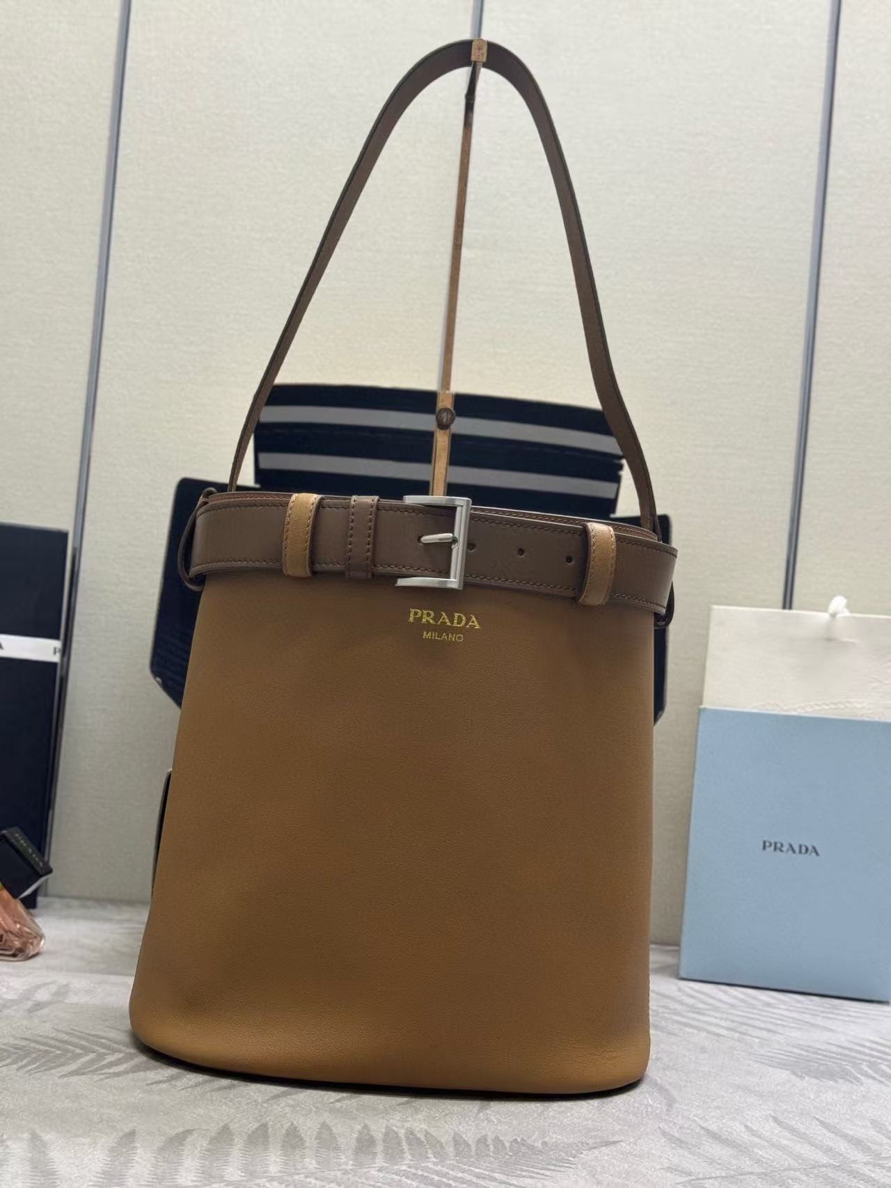 Prada brown leather tote bag with a belt buckle detail