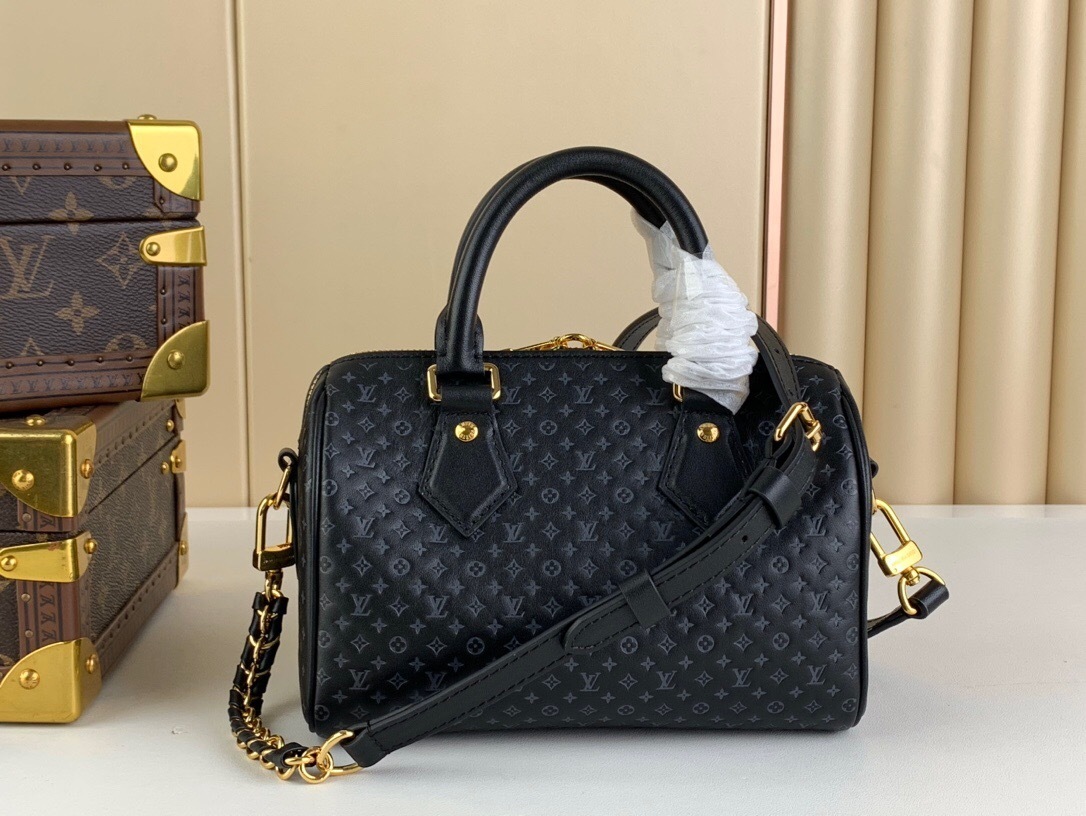 LV Speedy Bandoulière 20 bag in black Monogram Empreinte leather.