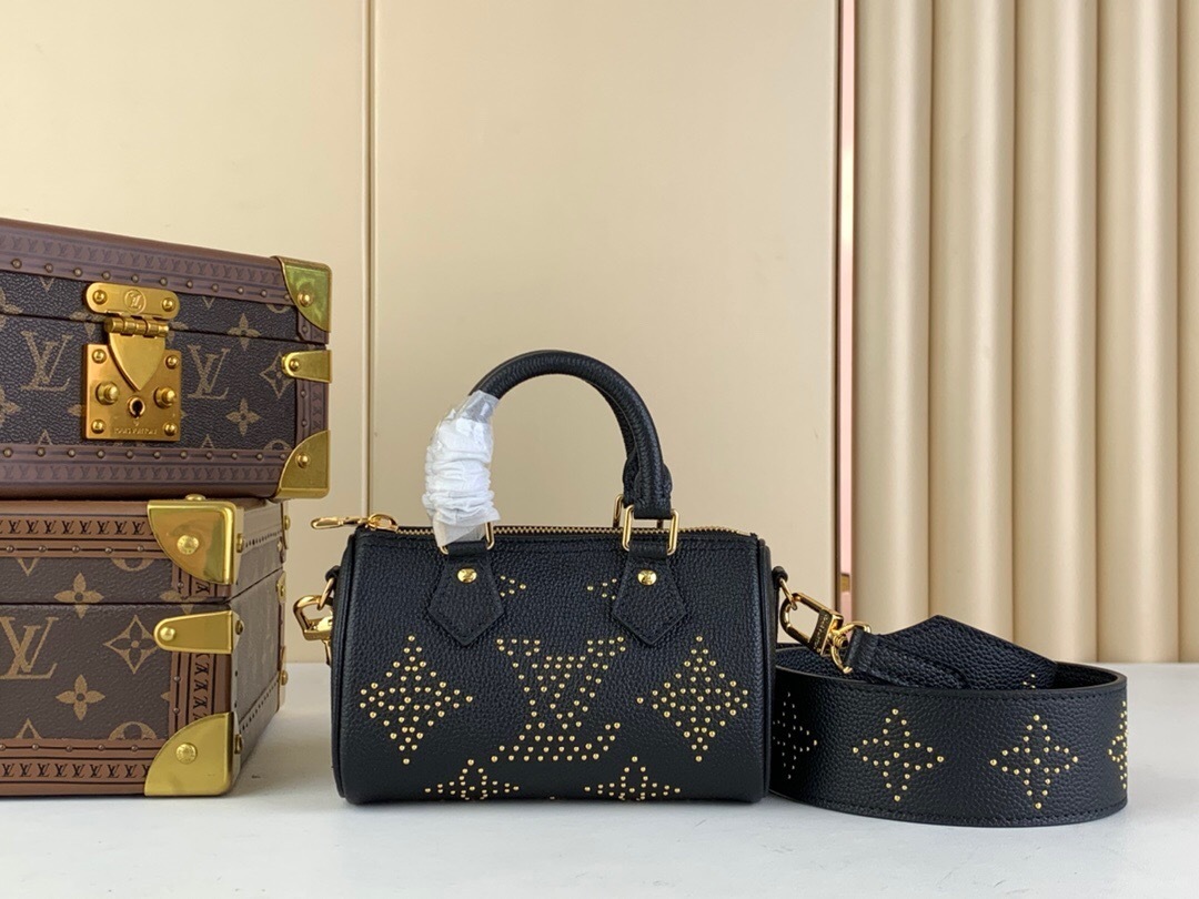 LV Nano Speedy bag in black Empreinte leather with gold-toned studs.