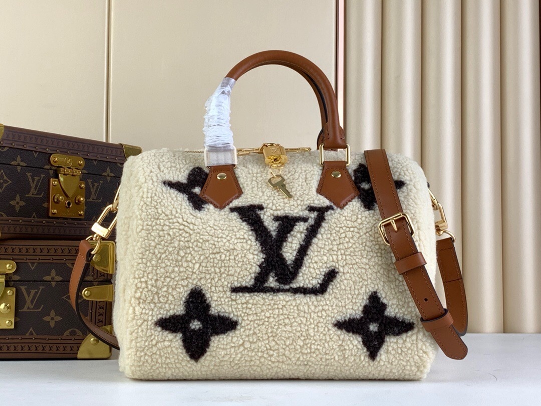 LV Monogram Shearling Speedy Bandouliere 25 in cream and brown.