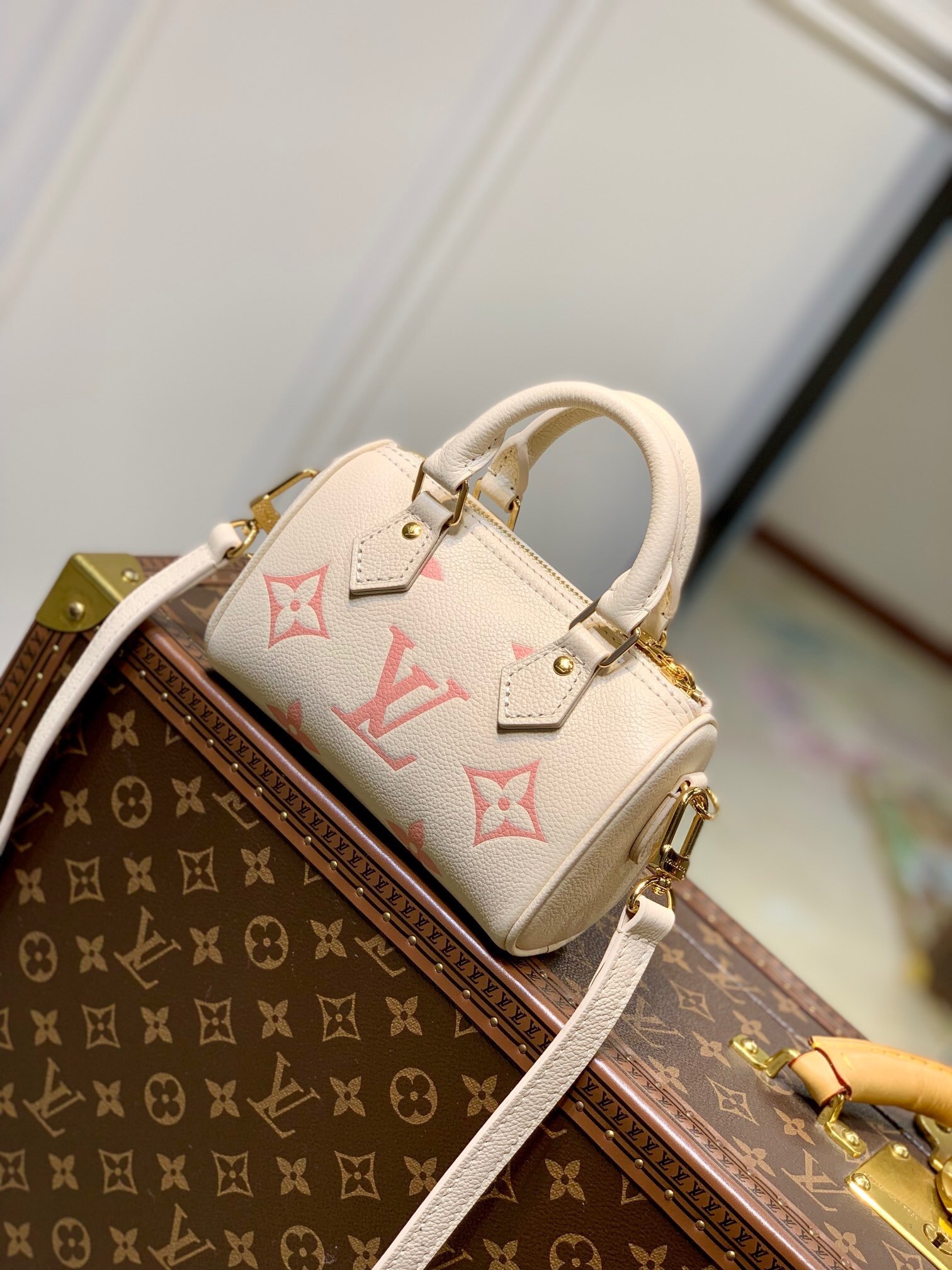 LV Nano Speedy bag in Monogram Empreinte leather with a bicolor palette.