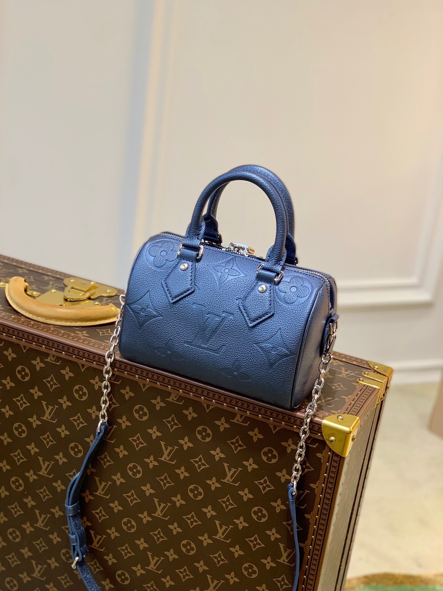 LV Speedy Bandoulière 20 handbag in navy blue Monogram Empreinte leather.