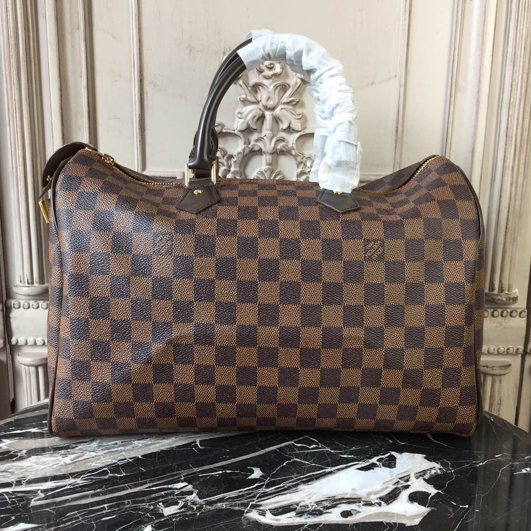 LV Speedy Bandouliere 30 bag in Damier Ebene canvas.