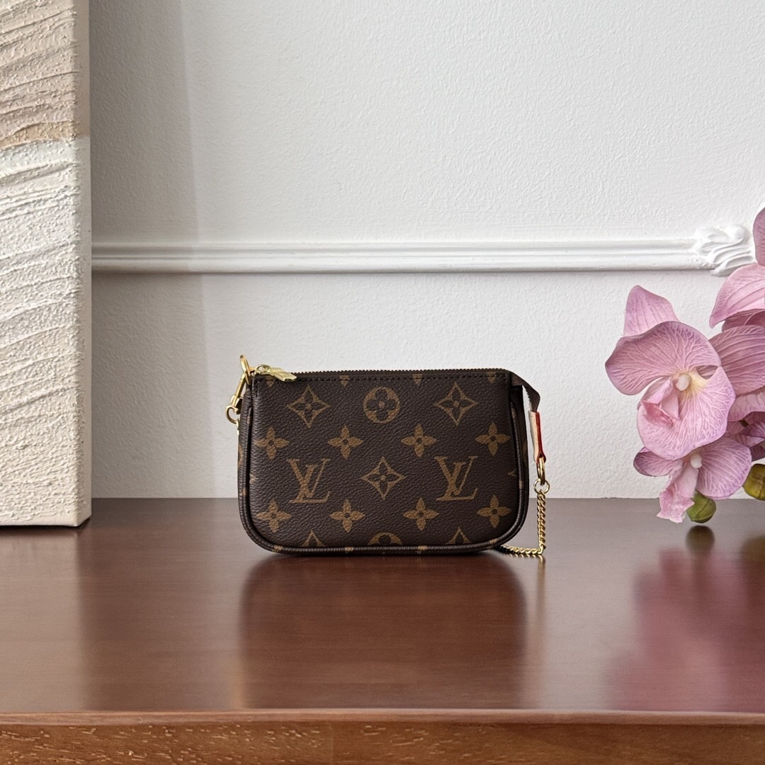 LV Cosmetic Pouch MM Mini Pochette Accessoires in monogram canvas.