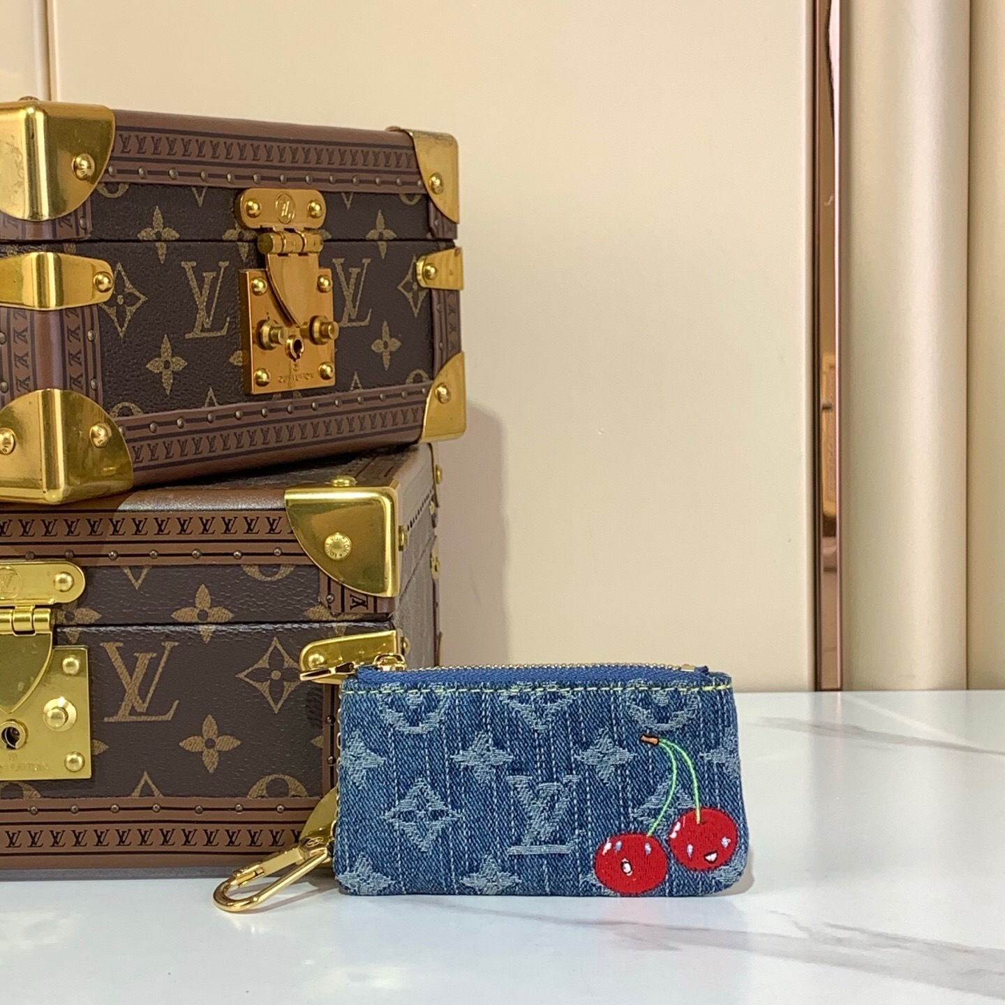 LV x Takashi Murakami Cherry Key Pouch in blue monogram denim.