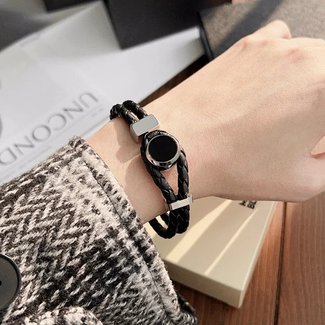 braided black leather bracelet with a silver-toned metal clasp
