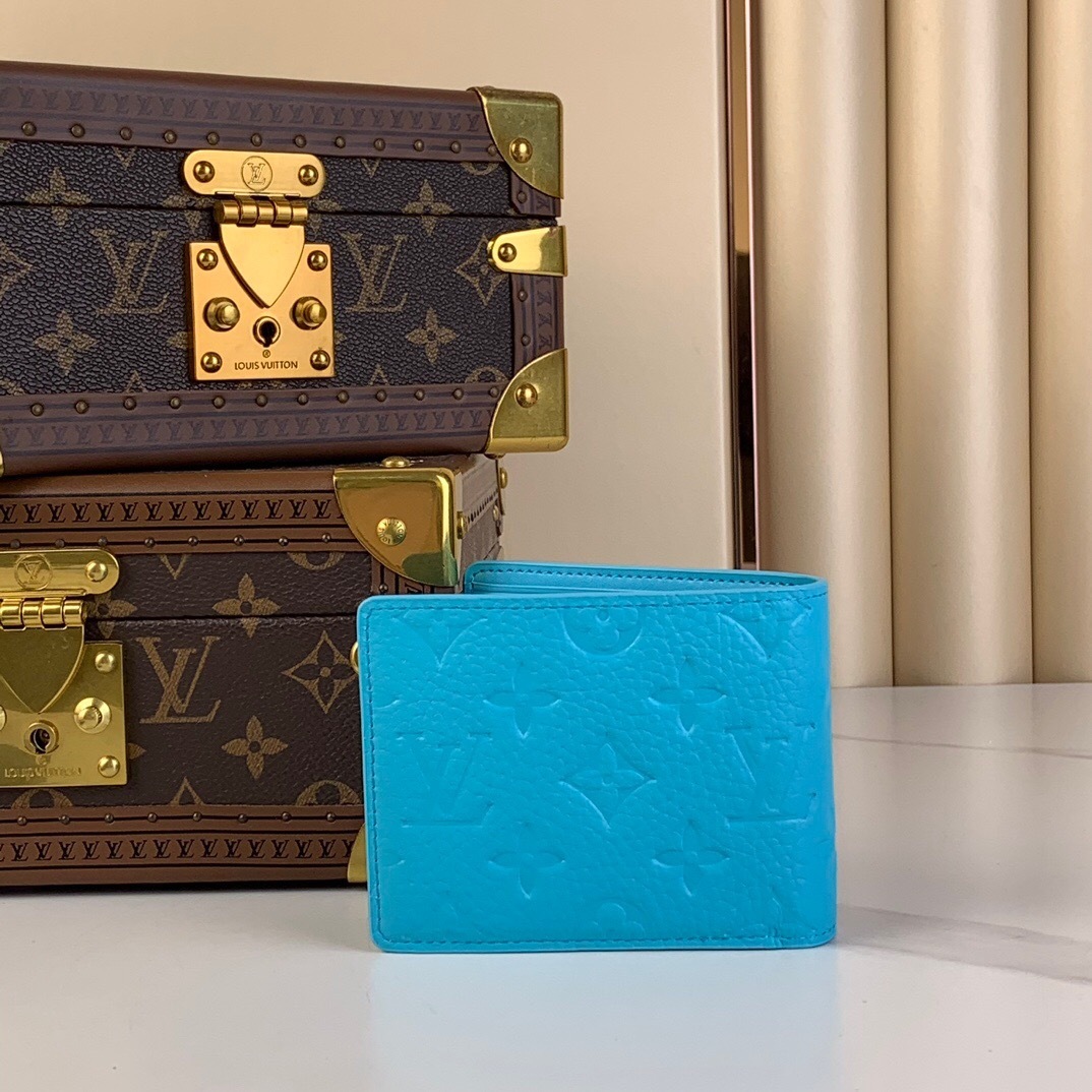 LV Multiple Wallet in turquoise Taurillon Monogram leather.