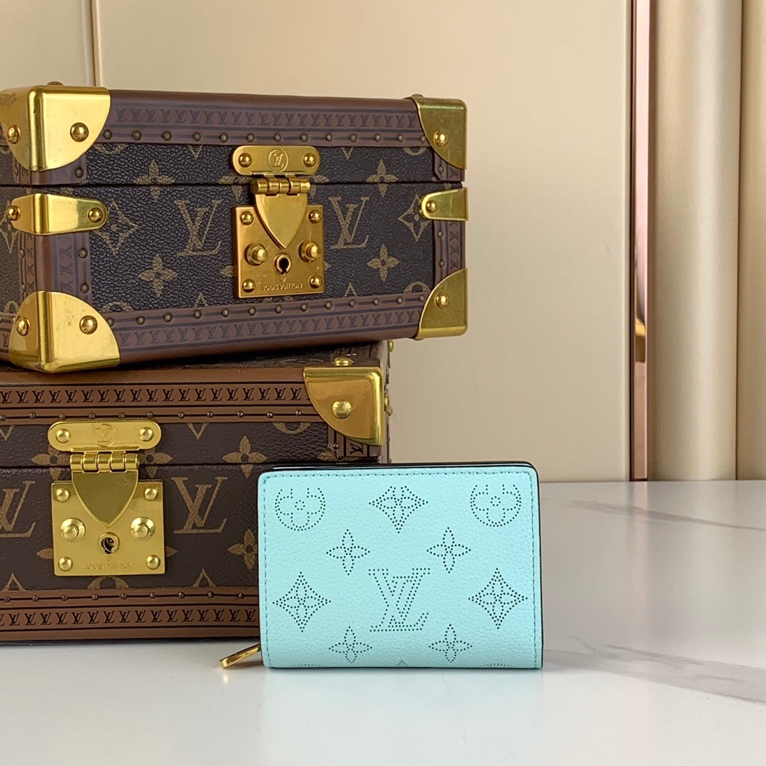 LV Cléa Wallet in Mahina leather with Monogram perforations in the color Vert Lagon.