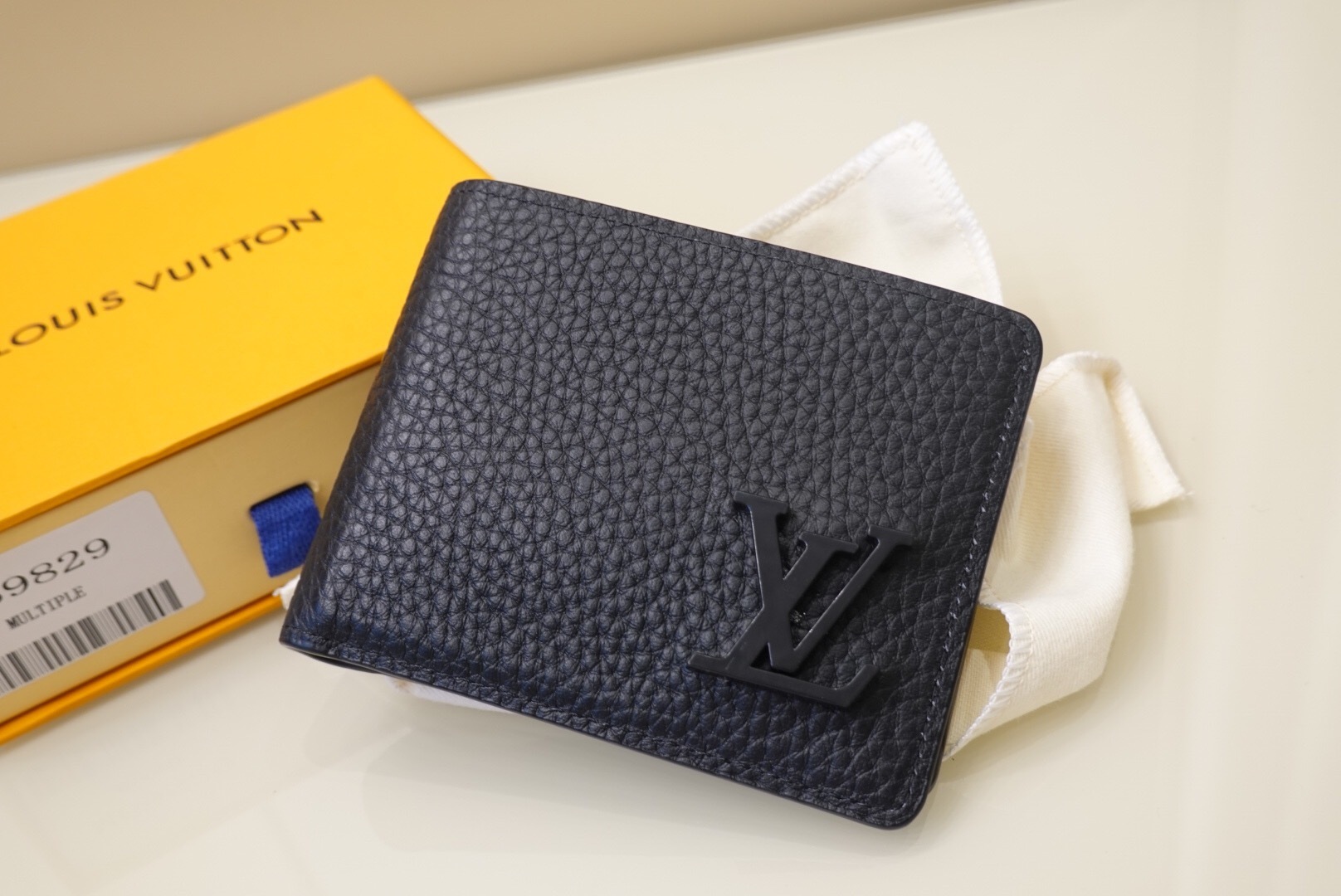 LV Multiple Wallet Aerogram collection in black calf leather.