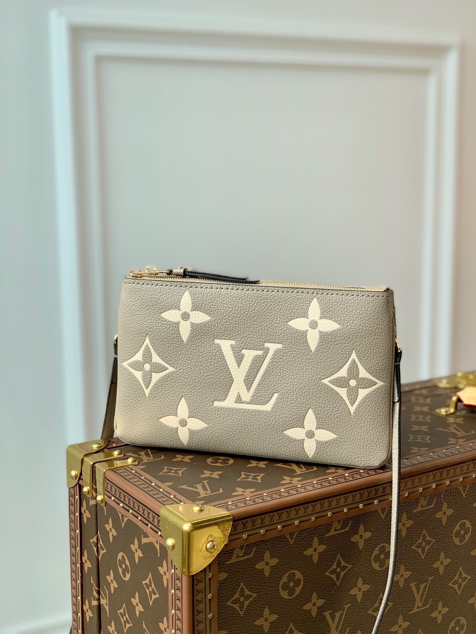 LV Double Zip Pochette in Tourterelle and Creme Empreinte Monogram Giant leather.