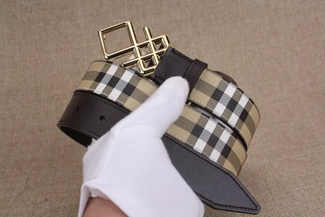 Burberry reversible check belt with a TB buckle.