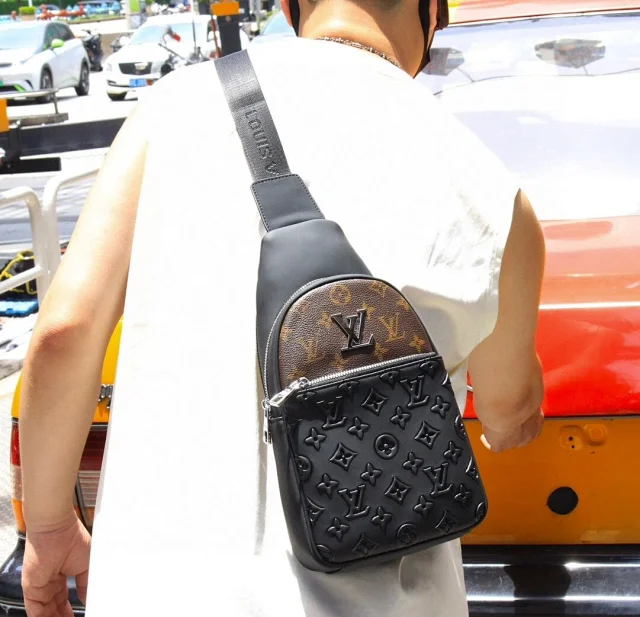 LV sling bag Monogram canvas and Taiga cowhide leather.