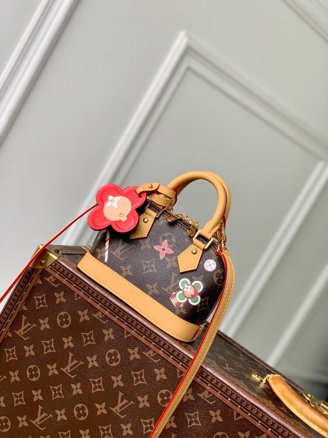 LV Nano Alma bag in Monogram canvas with a removable shoulder strap