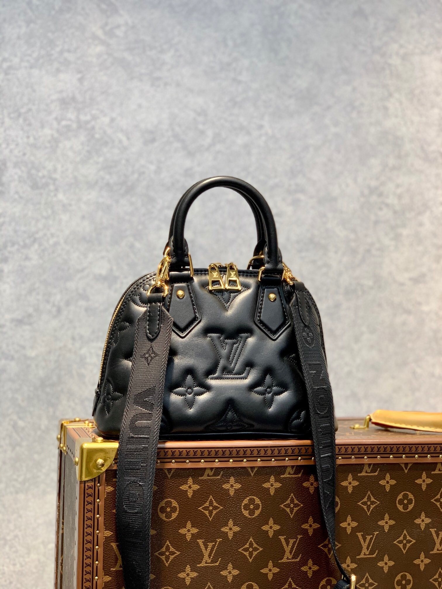 LV Alma BB Bubblegram handbag in black quilted calfskin leather.