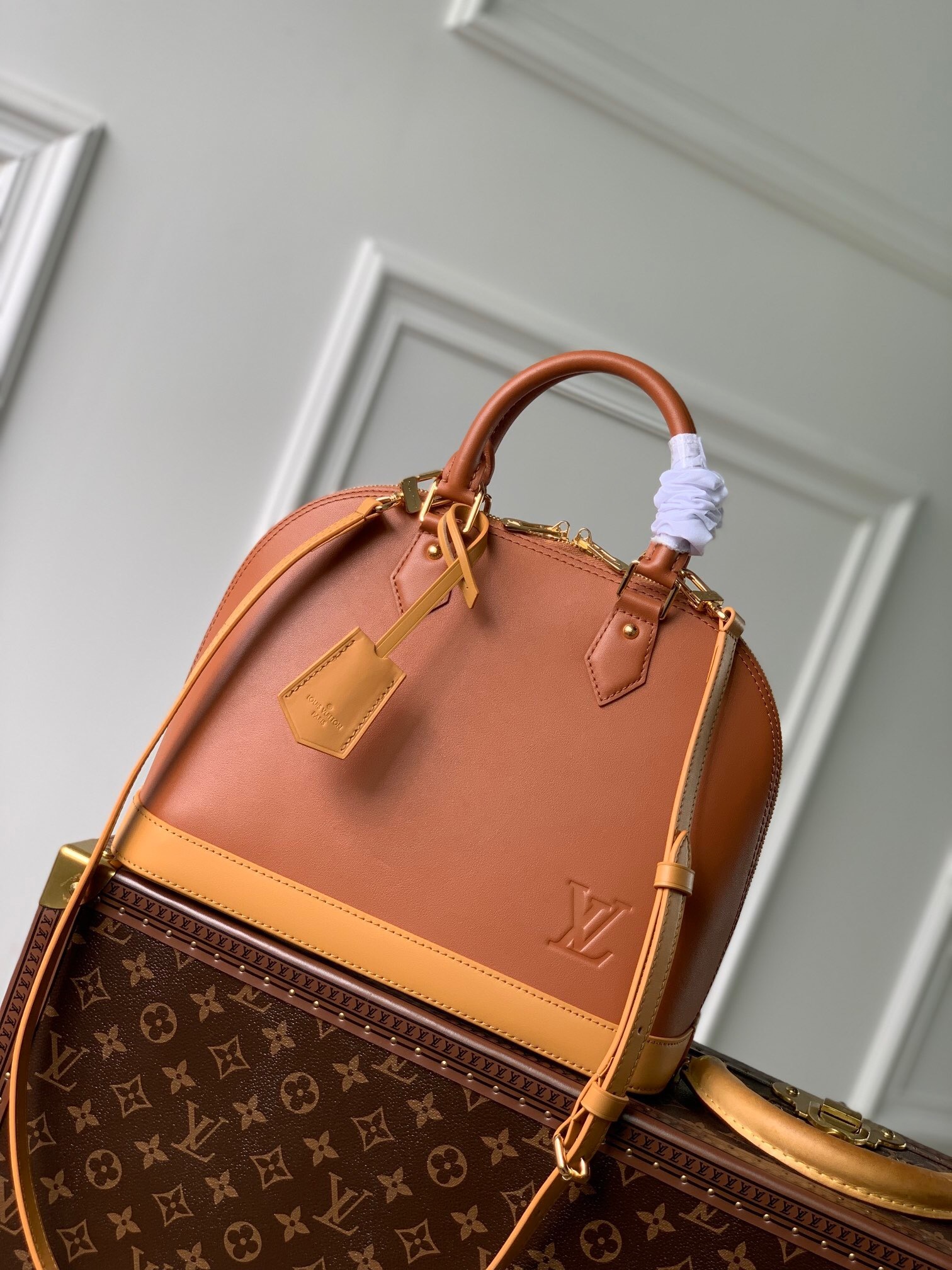 LV alma bag with natural cowhide leather trim.