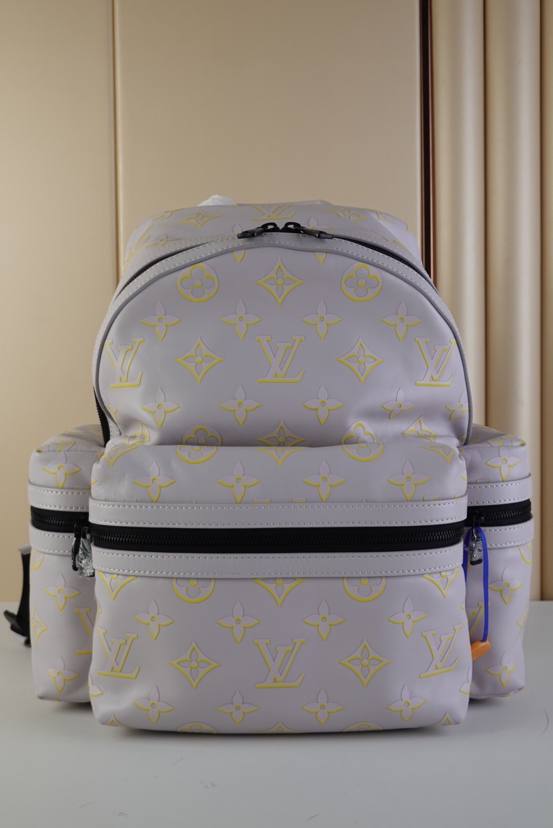 LV Discovery Backpack in a gray and yellow monogram pattern